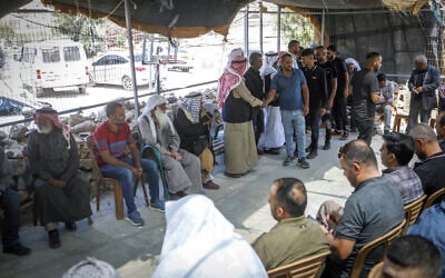 Mourners console the family of Awdah Hathaleen in the Palestinian village of Umm al-Kheir in the southern West Bank on July 29, 2025. (Wisam Hashlamoun/Flash90) Mourners console the family of Awdah Hathaleen in the Palestinian village of Umm al-Kheir in the southern West Bank on July 29, 2025. (Wisam Hashlamoun/Flash90)