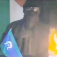 Screen capture from video of an anonymous figure claiming responsibility for setting fire to cars in an antisemitic attack in Melbourne, July 5, 2023. (X: Used in accordance with Clause 27a of the Copyright Law)
