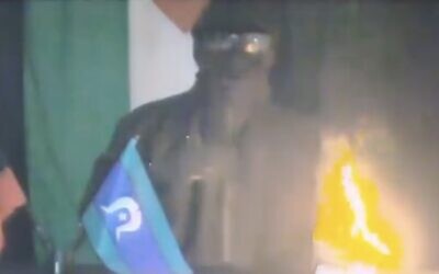 Screen capture from video of an anonymous figure claiming responsibility for setting fire to cars in an antisemitic attack in Melbourne, July 5, 2023. (X: Used in accordance with Clause 27a of the Copyright Law)