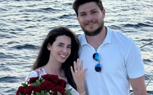Released hostages Sasha Troufanov and Sapir Cohen pose after getting engaged in a photo released on July 9, 2025 (Courtesy)