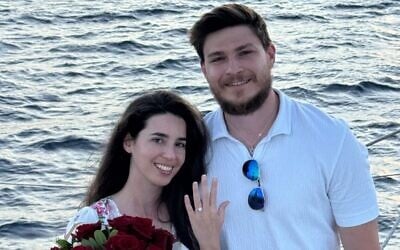 Released hostages Sasha Troufanov and Sapir Cohen pose after getting engaged in a photo released on July 9, 2025 (Courtesy)