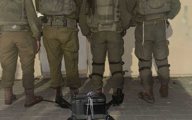 IDF troops pose with a drone that was used in an attempted weapons smuggling on the Jordan border, late July 10, 2025. (Israel Defense Forces) IDF troops pose with a drone that was used in an attempted weapons smuggling on the Jordan border, late July 10, 2025. (Israel Defense Forces)
