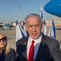Prime Minister Benjamin Netanyahu speaks to the press before boarding his flight to Washington DC, at Ben Gurion International Airport, July 6, 2025. (Lazar Berman/ The Times of Israel)