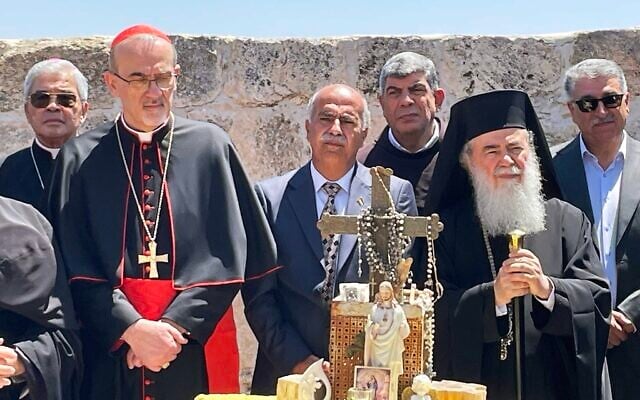 Pic Caption: Patriarch Theophilos III of Jerusalem (center left) and Latin Patriarch of Jerusalem Pierbattista Pizzaballa (center right) participate in a prayer ceremony in the archaeological site of the ruins of the fifth-century Church of St. George in Taybeh in the West Bank, July 14, 2025. (Jeremy Sharon / The Times of Israel) Pic Caption: Patriarch Theophilos III of Jerusalem (center left) and Latin Patriarch of Jerusalem Pierbattista Pizzaballa (center right) participate in a prayer ceremony in the archaeological site of the ruins of the fifth-century Church of St. George in Taybeh in the West Bank, July 14, 2025. (Jeremy Sharon / The Times of Israel)