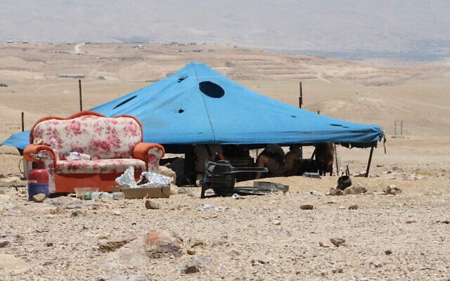 An encampment established by extremist settler activists some 50 meters from the Palestinian Bedouin hamlet of Mu'arrajat in the southern Jordan Valley in the West Bank, July 6, 2025. (Jeremy Sharon/The Times of Israel)