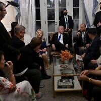 Prime Minister Benjamin Netanyahu and his wife Sara, center, meet with families of hostages held in Gaza, in Washington, DC, July 9, 2025. (Avi Ohayon/GPO)