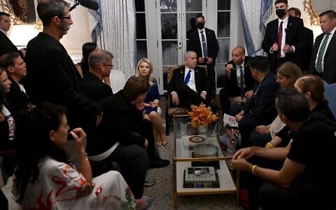 Prime Minister Benjamin Netanyahu and his wife Sara, center, meet with families of hostages held in Gaza, in Washington, DC, July 9, 2025. (Avi Ohayon/GPO)