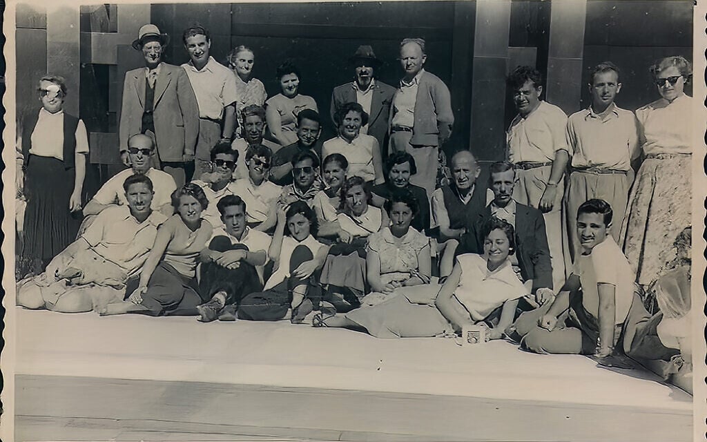 Tamar Fromer (aka Hela Hocherman) with her Lehi (Stern Gang) comerades in mid-1940s Palestine. Tamar, hair pulled back and seated next to man in sunglasses, is at center of photo. (Courtesy of Marisa Fox)
