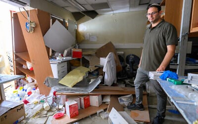Prof. Ehud Ohana surveys his lab in the Department of Clinical Biochemistry and Pharmacology at Ben-Gurion University of the Negev, destroyed by the June 19, 2025, Iranian ballistic missile strike, on June 24, 2025. (Courtesy/Dani Machlis)