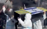 Fans of the All Boys soccer club in Argentina carry a mock coffin in the colors of the Atlanta football club, which hails from a predominantly Jewish neighborhood in Buenos Aires,  and draped with the Israeli flag ahead of a match between the two teams on June 30, 2025. (Screen capture via X, used in accordance with Clause 27a of the Copyright Law)