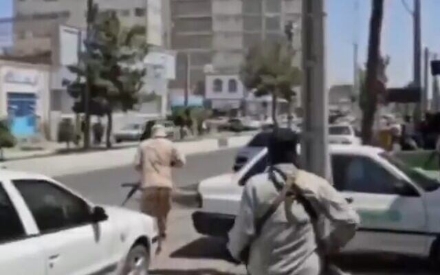 Iranian security forces run toward the scene of an attack on a courthouse by separatists in the city of Zahedan on July 26, 2025 (screencapture/X) Iranian security forces run toward the scene of an attack on a courthouse by separatists in the city of Zahedan on July 26, 2025 (screencapture/X)