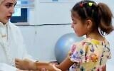Screen capture from undated video of Sidra Al Bordeeni, 12, who was injured in the Gaza Strip, being fitted with a prosthetic arm in Amman, Jordan. (X: Used in accordance with Clause 27a of the Copyright Law)