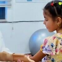 Screen capture from undated video of Sidra Al Bordeeni, 12, who was injured in the Gaza Strip, being fitted with a prosthetic arm in Amman, Jordan. (X: Used in accordance with Clause 27a of the Copyright Law)