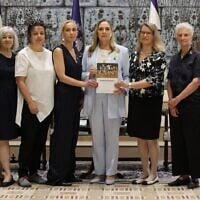 The authors of the Dinah Project's report on sexual violence on and since October 7 are pictured with First Lady Michal Herzog (center) at the President's Residence, Jerusalem, July 8, 2025. (Itzik Biran)
