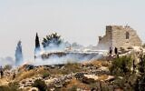 A fire burns next to the archaeological site of the ruins of the Church of St. George in the West Bank town of Taybeh, July 9, 2025. Residents allege that local settler extremists started the fire. (Courtesy Nabd ElHaya online radio station)