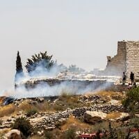A fire burns next to the archaeological site of the ruins of the Church of St. George in the West Bank town of Taybeh, July 9, 2025. Residents allege that local settler extremists started the fire. (Courtesy Nabd ElHaya online radio station)