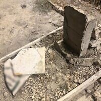 A damaged grave is seen in a cemetery near the Old City of Jerusalem, after two teens were arrested on suspicion of vandalizing and damaging the graveyard, on July 11, 2025. (Israel Police)