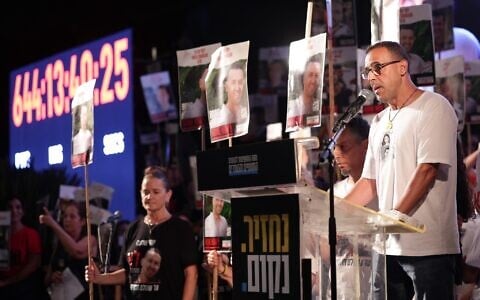 Released hostage Eli Sharabi speaks at a weekly rally at Hostages Square, Tel Aviv, July 12, 2025. (Alon Gilboa/Hostages and Missing Families Forum)