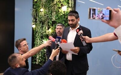 Religious Services Minister Michael Malkieli announces the Shas party's decision to quit Prime Minister Benjamin Netanyahu's government, July 16, 2025. (Yaakov Cohen)