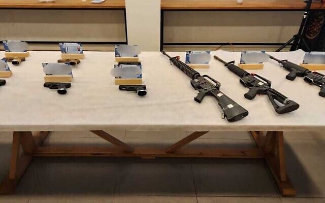 Illegally-trafficked weapons acquired by a police informant over the past year, as part of a covert investigation that was unveiled on July 21, 2025. (Israel Police)