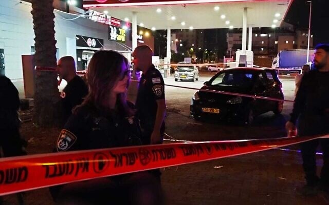 Police officers secure the scene of a deadly shooting that killed a man in his 20s in Ramle on July 30, 2025. (Israel Police)
