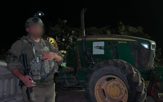 IDF troops return a tractor that had been looted on October 7, 2023, and found in northern Gaza's Beit Hanoun to its owners in Kfar Aza, in a video issued by the military on July 23, 2025. (Israel Defense Forces) IDF troops return a tractor that had been looted on October 7, 2023, and found in northern Gaza's Beit Hanoun to its owners in Kfar Aza, in a video issued by the military on July 23, 2025. (Israel Defense Forces)