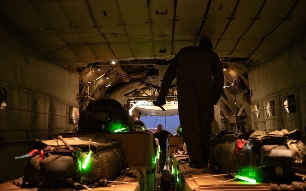 Israeli Air Force staff prepare boxes of humanitarian aid ahead of an airdrop in the Gaza Strip, July 26, 2025. (IDF)