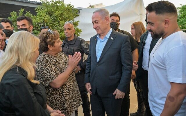 Prime Minister Benjamin Netanyahu, center, visits Ofakim and meets local Oct. 7 hero Rachel Edry, July 3, 2025. (Kobi Gideon/GPO) Prime Minister Benjamin Netanyahu, center, visits Ofakim and meets local Oct. 7 hero Rachel Edry, July 3, 2025. (Kobi Gideon/GPO)