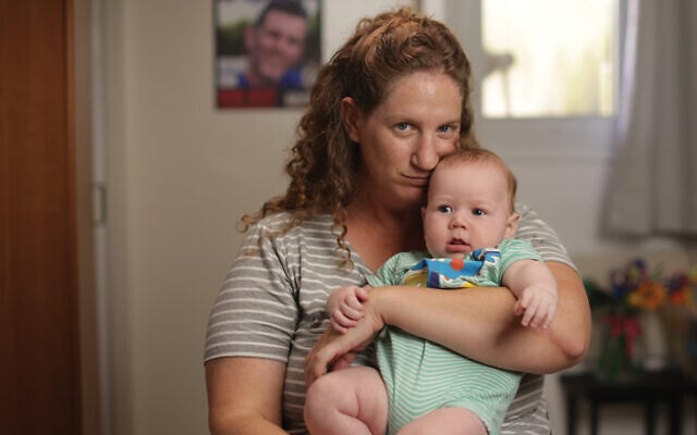Ela Haimi and her baby, Lotan, the youngest of her four children, born after her husband Tal Haimi was killed defending their kibbutz on October 7, 2023 and his body taken hostage to Gaza (David Janovic/IDFWO)