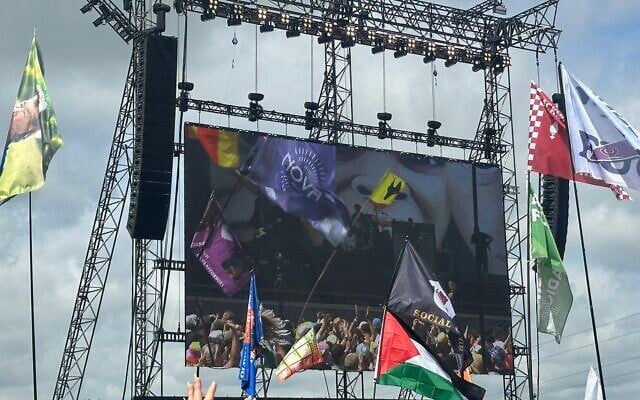 Michael Garcia's Supernova festival flag appears on the big screen at the Glastonbury music festival in the UK, June 2025. (Courtesy)