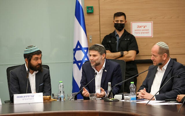 Finance Minister Bezalel Smotrich, center, speaks at a meeting of the Knesset Foreign Affairs and Defense Committee's Subcommittee for Judea and Samaria at the Knesset in Jerusalem, July 29, 2025. (Danny Shem-Tov/Knesset Spokesman)