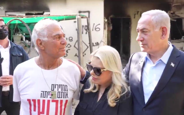 Prime Minister Benjamin Netanyahu and his wife Sara with freed hostage Gadi Mozes, at Kibbutz Nir Oz on July 3, 2025. (X screenshot, used in accordance with clause 27a of the copyright law)