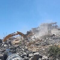 This screenshot from a Hamas video published July 10, 2025, shows terror operatives attacking Israeli troops carrying out demolition work in southern Gaza's Khan Younis, on July 9, 2025. (Hamas, via Telegram)