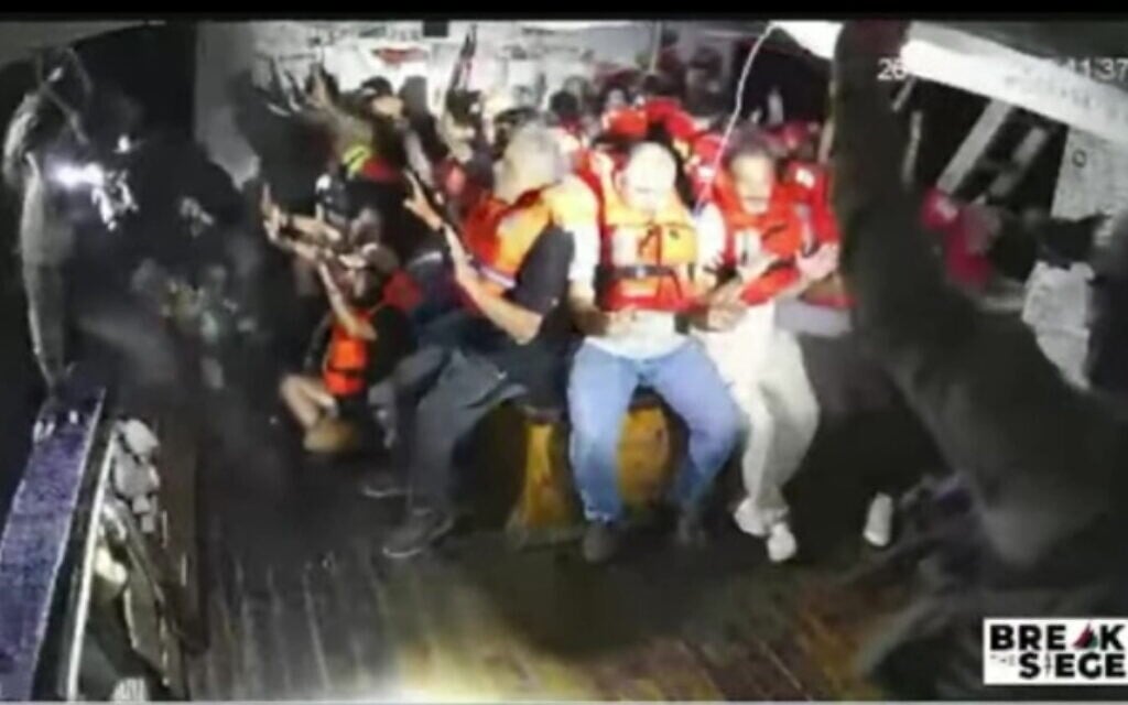 A screenshot taken from live footage of the Handala activist boat trying to break the naval blockade on Gaza as it is boarded by Israeli Navy forces, on July 26, 2025. (Screenshot: Salaamedia on Youtube)