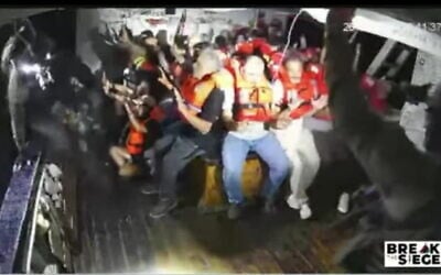 A screenshot taken from live footage of the Handala activist boat trying to break the naval blockade on Gaza as it is boarded by Israeli Navy forces, on July 26, 2025. (Screenshot: Salaamedia on Youtube)