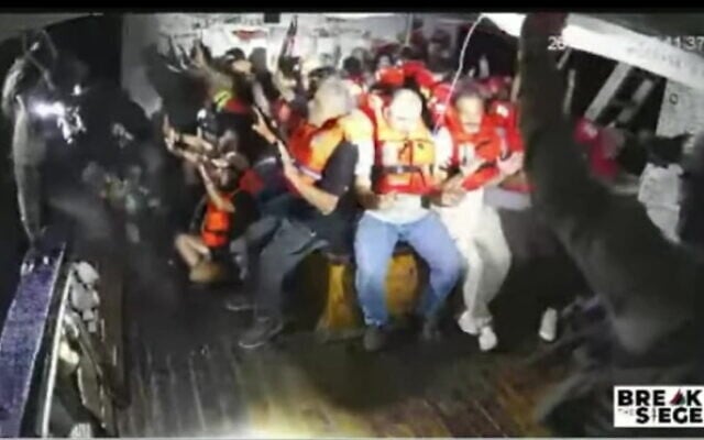 A screenshot taken from live footage of the Handala activist boat trying to break the naval blockade on Gaza as it is boarded by Israeli Navy forces, on July 26, 2025. (Screenshot: Salaamedia on Youtube)