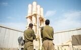 Illustrative: Israeli Air Force soldiers pose in front of an Arrow air defense system battery, in a photo issued by the IDF on June 26, 2025. (Israel Defense Forces)