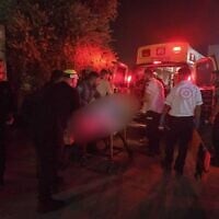Paramedics arrive to the scene of a shooting which left one woman dead and another critically injured in Lod on July 12, 2025. (Magen David Adom)