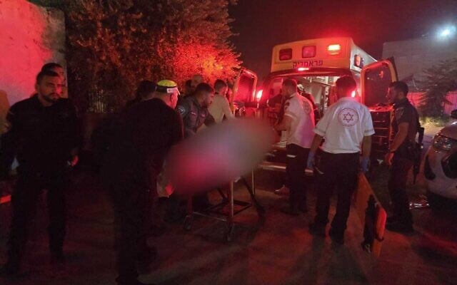 Paramedics arrive to the scene of a shooting which left one woman dead and another critically injured in Lod on July 12, 2025. (Magen David Adom)