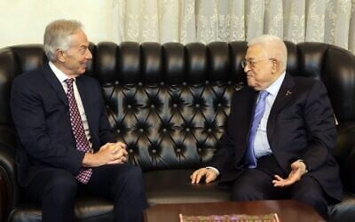 This handout picture released by the Palestinian Authority's press office (PPO) shows President Mahmoud Abbas (R) meeting with Britain's former prime minister Tony Blair in Amman, Jordan, on July 13, 2025. (Photo by Thaer GHANAIM / PPO / AFP)