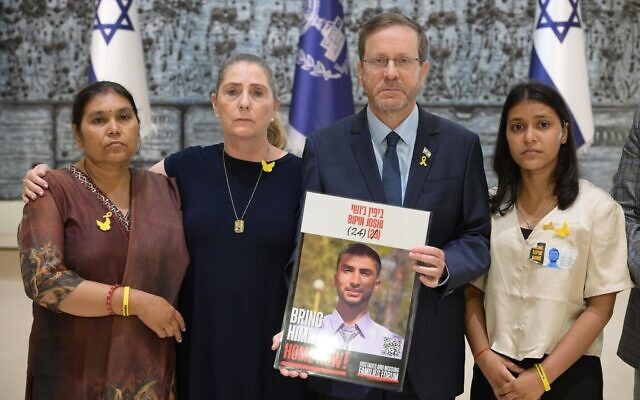 President Isaac Herzog meets with the family of Nepali hostage Bipin Joshi in Jerusalem on August 17, 2025 (Amos Ben Gershom/GPO)