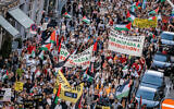 Illustrative: Protesters hold banners and flags, including one calling for 'Intifada revolution,' during a pro-Palestinian, anti-Israel demonstration in Copenhagen, Denmark on August 24, 2025. (Ritzau Scanpix/ Emil Nicolai Helms/ via REUTERS)