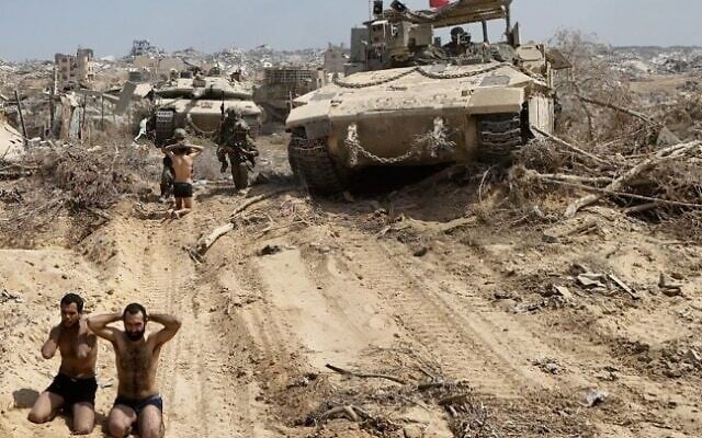 Hamas operatives surrender to IDF troops of the Givati Brigade in northern Gaza's Beit Hanoun, August 2, 2025. (Israel Defense Forces)
