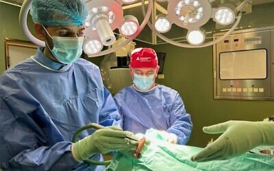 Dr. David Hasan (right) performs surgery in the Gaza Strip, January 2024.(Courtesy)