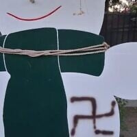 A swastika painted on a cardboard snowman at the entrance to the Israeli-American Council building in Los Angeles, August 10, 2025 (IAC)