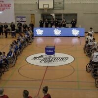 Members of the British men's wheelchair basketball squad turn their backs while Israel's national anthem "Hatikva" plays before a Basketball Nations Cup game in Cologne, Germany, on August 16, 2025. (YouTube screenshot)