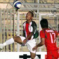 Palestinian soccer player Suleiman Obeid (L) vies for the ball with Iranian player Hashem Beikzadeh during their West Asian Football Federation Championship (WAFF) match in the Jordanian capital Amman, 20 June 2007. (KHALIL MAZRAAWI / AFP)
