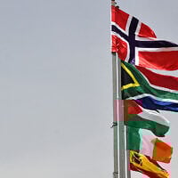 The flags of (from top) Norway, South Africa, Palestine, Ireland, and Spain, are raised at an entrance of Ramallah city in the West Bank on May 28, 2024. (Zain JAAFAR / AFP)