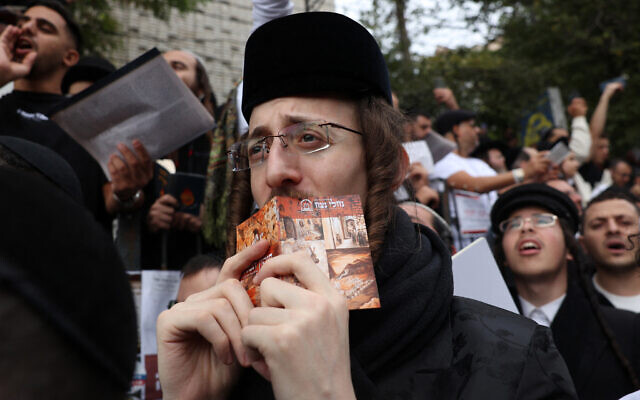 A Hasidic Jewish pilgrim prays close to the tomb of Rabbi Nachman ahead of Rosh Hashanah, the Jewish New Year, in Uman, central Ukraine, on October 2, 2024. (Anatolii STEPANOV / AFP) A Hasidic Jewish pilgrim prays close to the tomb of Rabbi Nachman ahead of Rosh Hashanah, the Jewish New Year, in Uman, central Ukraine, on October 2, 2024. (Anatolii STEPANOV / AFP)