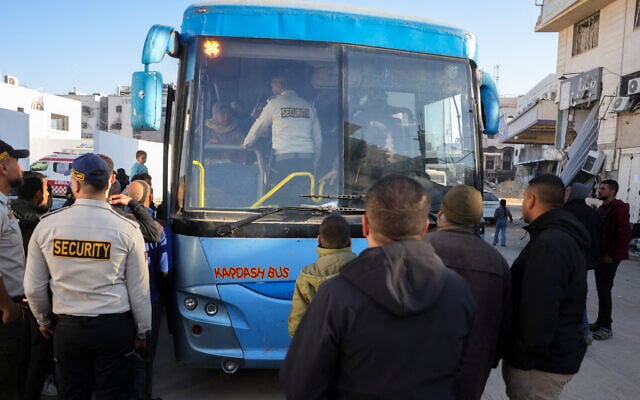 Illustrative: Palestinian security guards stand next to a bus taking patients from al-Shifa hospital in Gaza City for treatment through the Rafah crossing on February 1, 2025. (Bashar Taleb/AFP) Illustrative: Palestinian security guards stand next to a bus taking patients from al-Shifa hospital in Gaza City for treatment through the Rafah crossing on February 1, 2025. (Bashar Taleb/AFP)